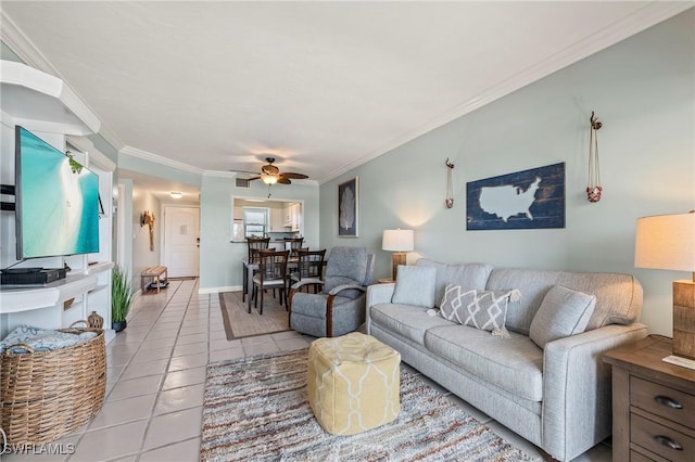 803 River Point Dr Unit 306B, Naples, FL 34102 - living area with baseboards, ceiling fan, ornamental molding, and light tile patterned floors