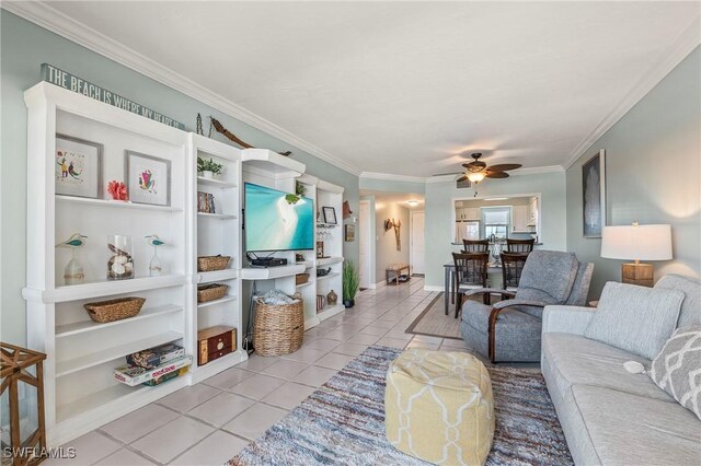803 River Point Dr Unit 306B, Naples, FL 34102 - living area featuring crown molding, ceiling fan, baseboards, and light tile patterned floors