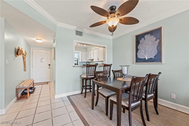 803 River Point Dr Unit 306B, Naples, FL 34102 - dining room with ceiling fan, visible vents, crown molding, light tile patterned floors, and baseboards