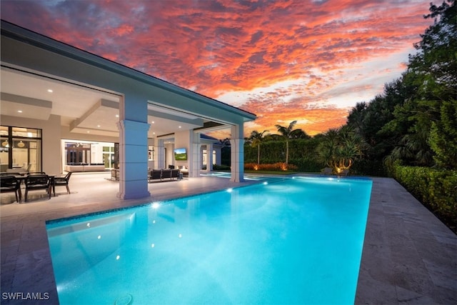 view of swimming pool featuring a patio area