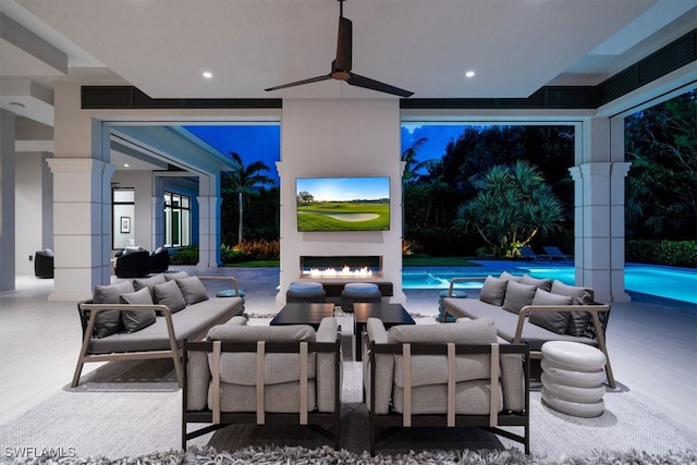 view of patio with outdoor lounge area and ceiling fan