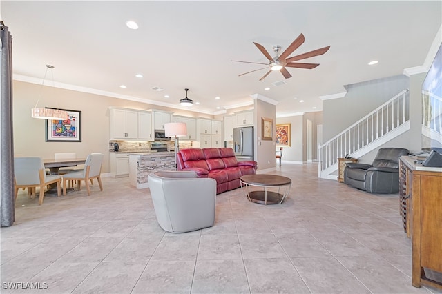 living room featuring crown molding, light tile patterned flooring, and ceiling fan