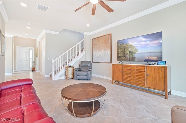 living room featuring ceiling fan, ornamental molding, and light tile patterned floors