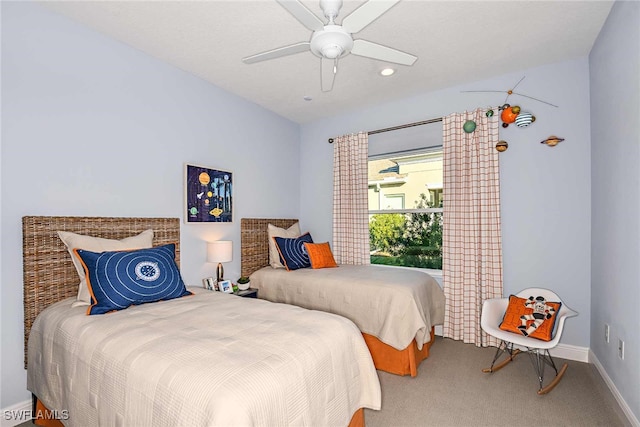 carpeted bedroom featuring ceiling fan