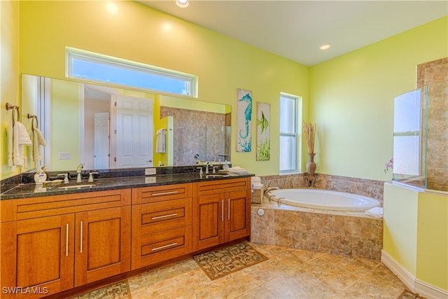 bathroom featuring tile patterned flooring, vanity, and independent shower and bath