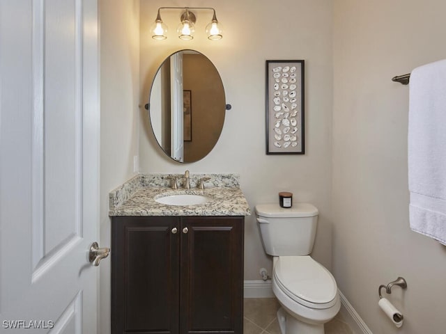 bathroom featuring vanity, toilet, and tile patterned floors