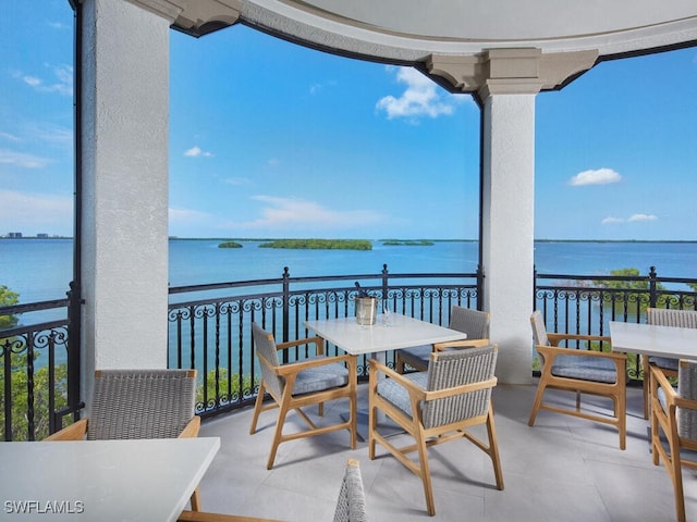 balcony featuring a water view