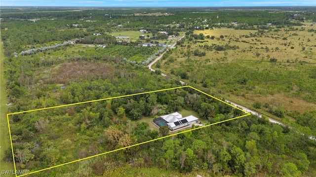 18351 Leetana Rd, North Fort Myers, FL 33917 - drone / aerial view featuring a rural view and a view of trees
