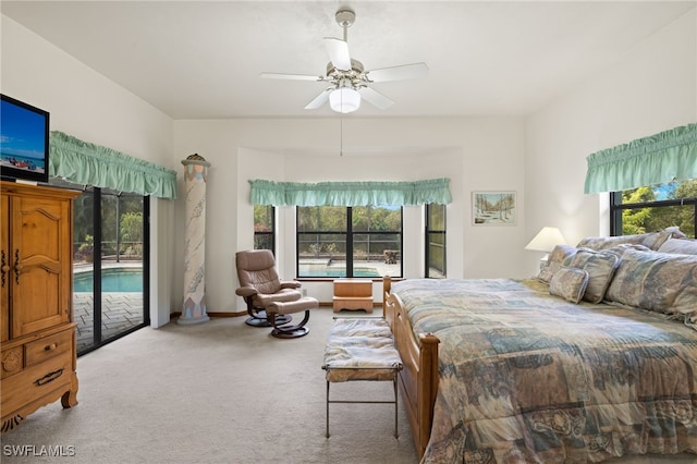 bedroom featuring carpet flooring, access to outside, multiple windows, and ceiling fan