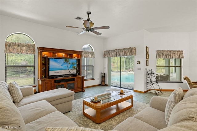 tiled living room featuring ceiling fan