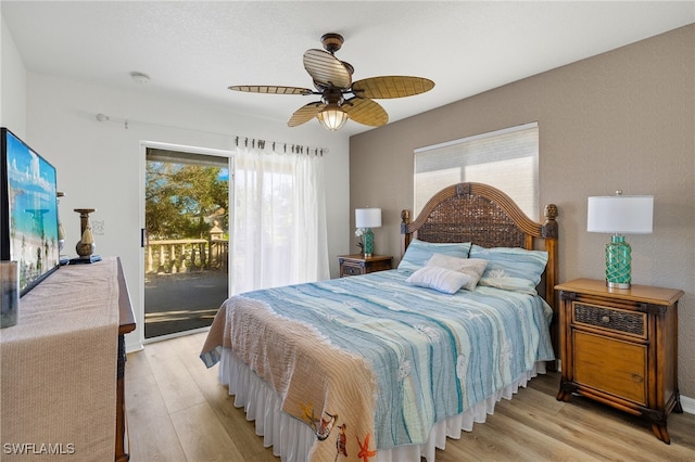 bedroom with ceiling fan, access to exterior, and light hardwood / wood-style floors