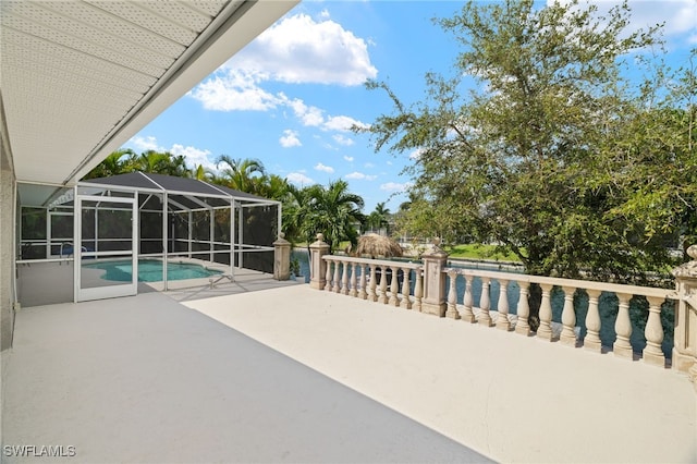 view of patio / terrace with glass enclosure