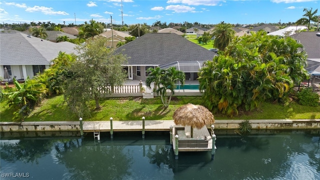 birds eye view of property with a water view