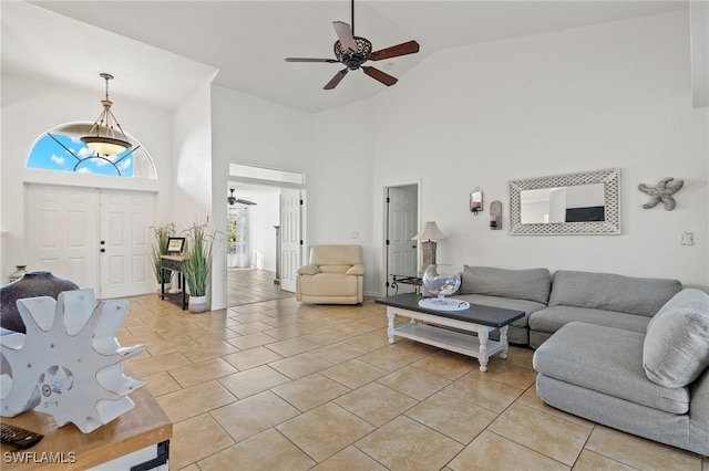 living room featuring high vaulted ceiling, light tile patterned floors, and ceiling fan