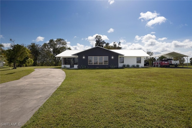 view of front facade featuring a front lawn and a carport