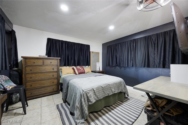 tiled bedroom with a textured ceiling