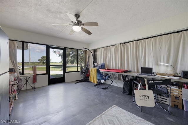 home office featuring a textured ceiling and ceiling fan