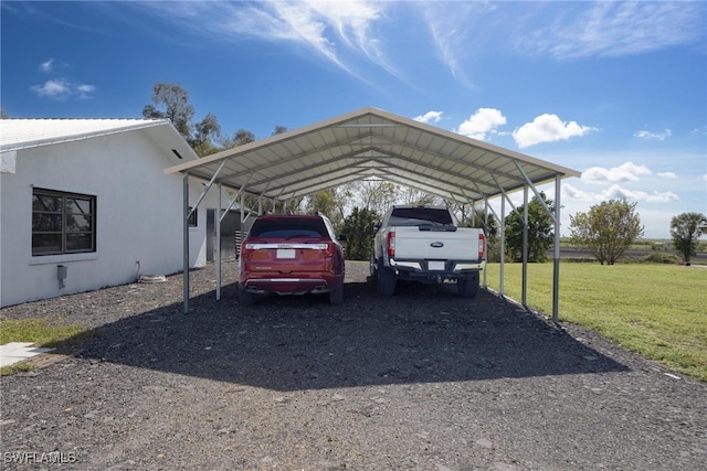 view of vehicle parking featuring a lawn and a carport