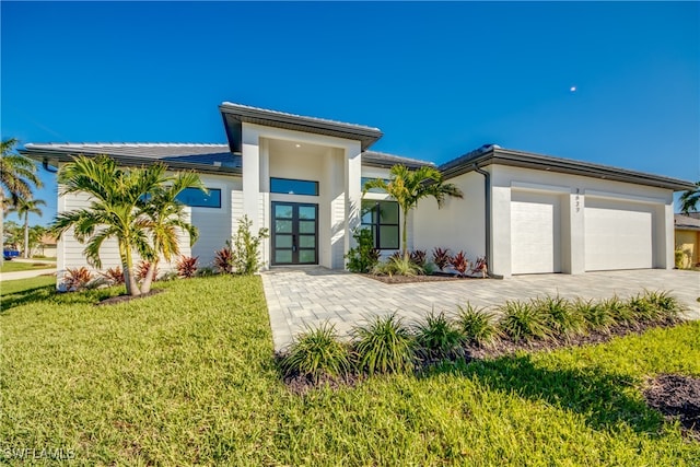 view of front facade featuring a front yard and a garage