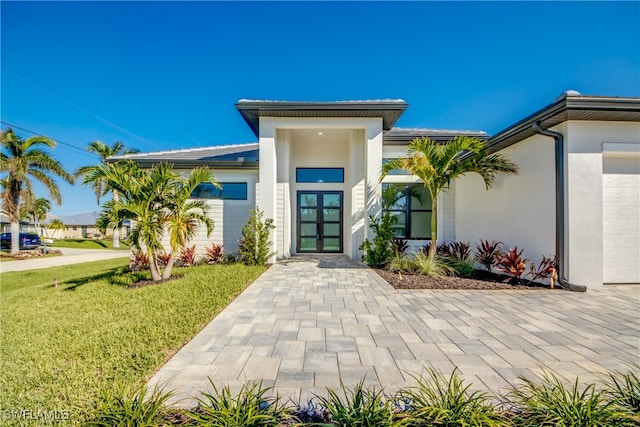 property entrance with a yard