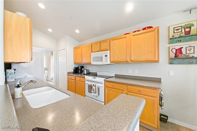 kitchen featuring white appliances, light brown cabinets, vaulted ceiling, sink, and kitchen peninsula