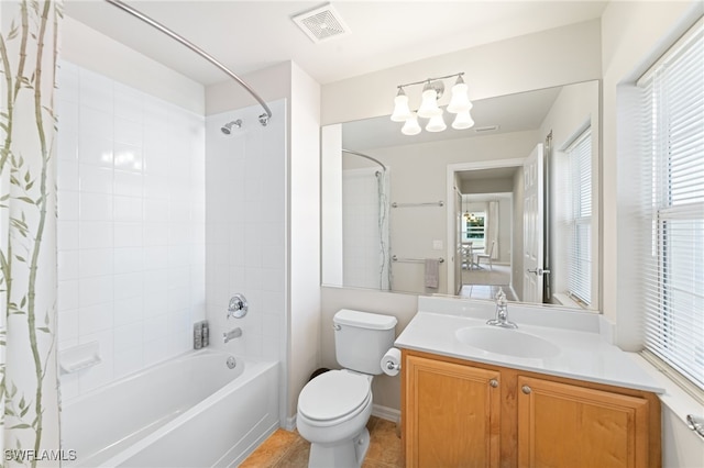 full bathroom featuring shower / bath combo, toilet, and vanity