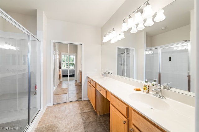 bathroom with tile patterned flooring, an enclosed shower, and vanity