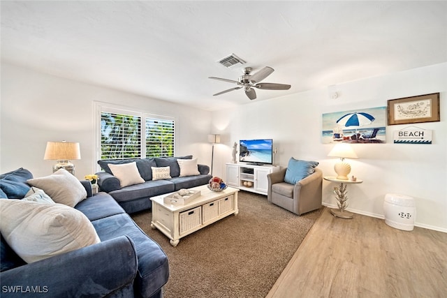 living room with ceiling fan and light wood-type flooring