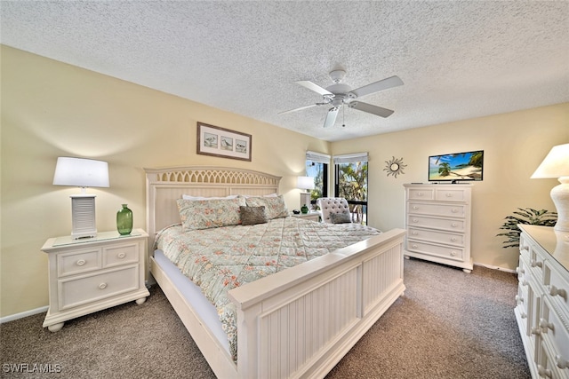 carpeted bedroom featuring a textured ceiling and ceiling fan