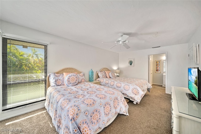 bedroom with ceiling fan and carpet floors