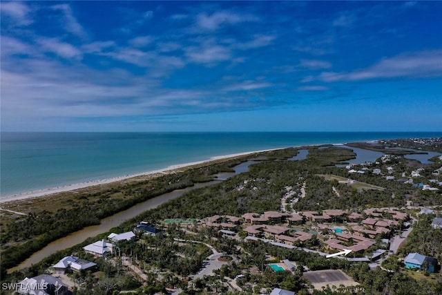 drone / aerial view with a water view and a beach view