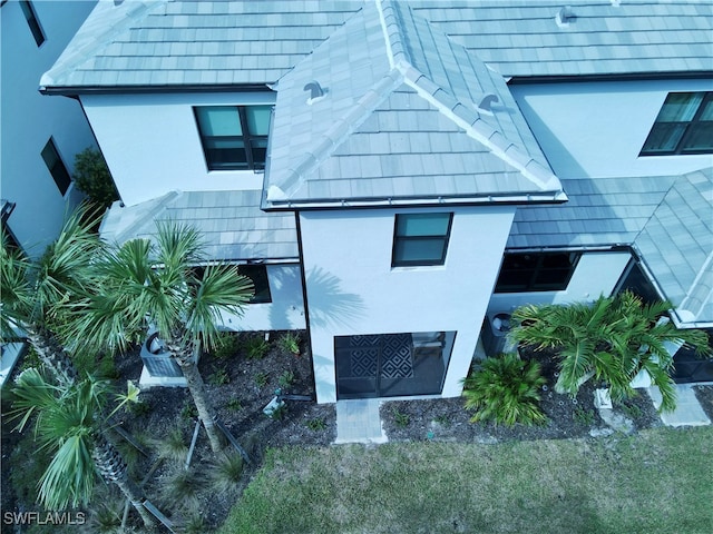 view of side of home featuring stucco siding