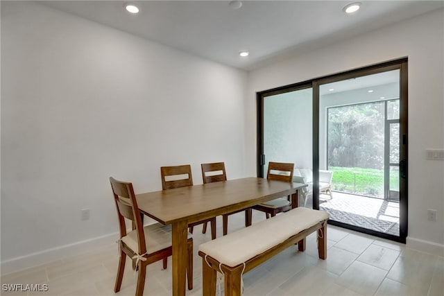 dining space featuring recessed lighting and baseboards