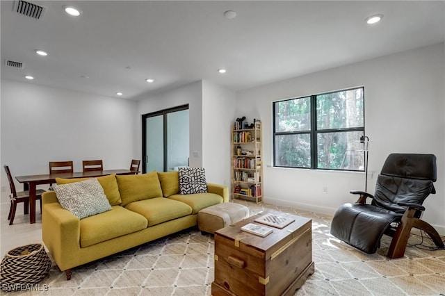 living area with recessed lighting and visible vents