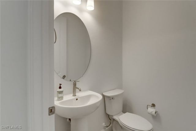 bathroom with toilet and sink