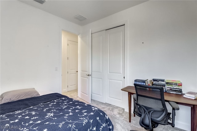 carpeted bedroom featuring a closet