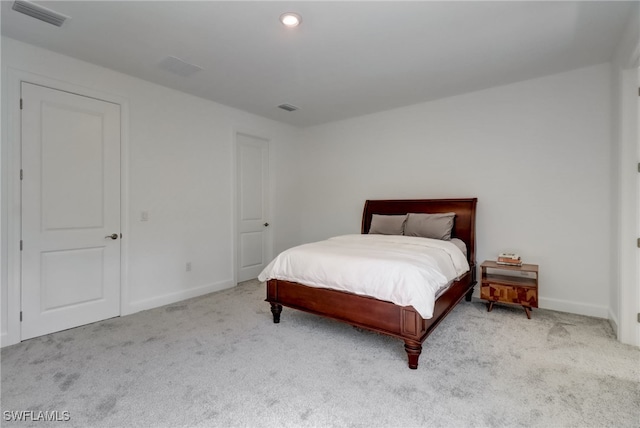 bedroom featuring light colored carpet