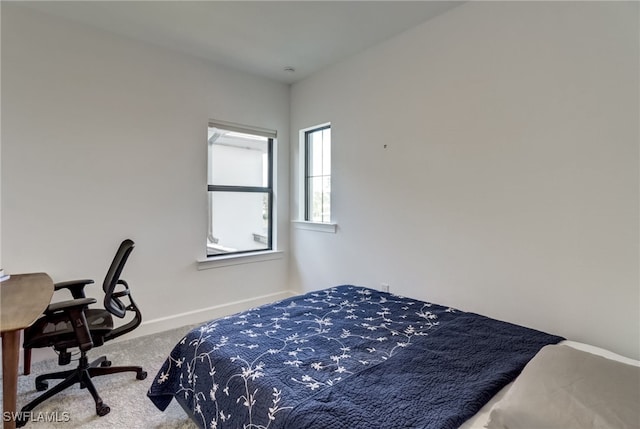 carpeted bedroom with baseboards