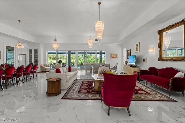 living room with a healthy amount of sunlight and a chandelier