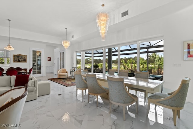 dining space with an inviting chandelier