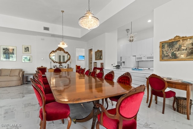 dining room featuring a notable chandelier