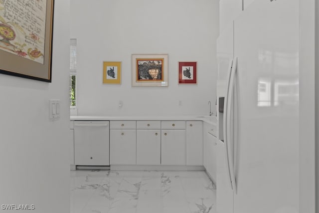 interior details featuring sink and white appliances