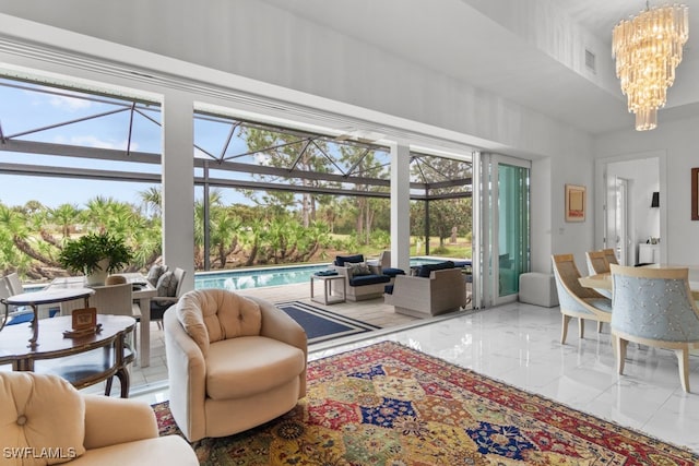 sunroom / solarium with a healthy amount of sunlight and a chandelier