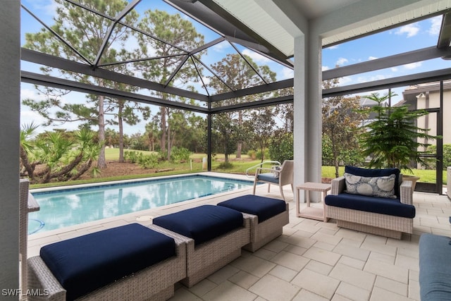 view of swimming pool with a patio area and glass enclosure