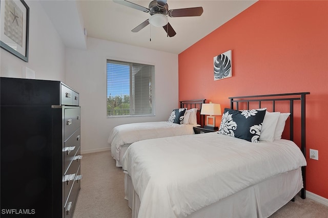 bedroom with ceiling fan and light colored carpet