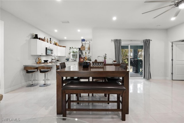 dining space featuring ceiling fan