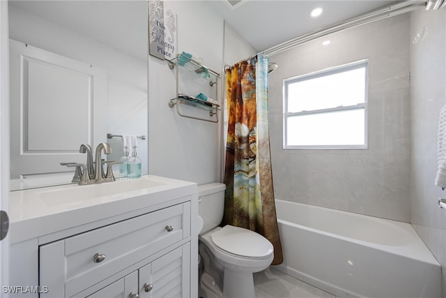 full bathroom featuring toilet, vanity, shower / bath combination with curtain, and tile patterned floors