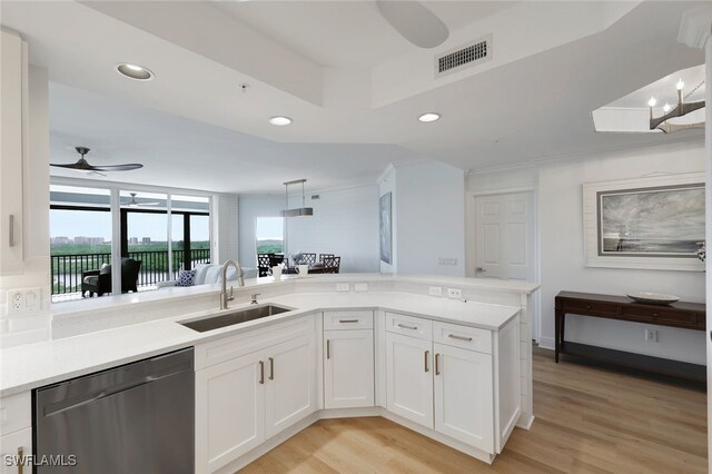kitchen with stainless steel dishwasher, a ceiling fan, a sink, light wood-style flooring, and visible vents