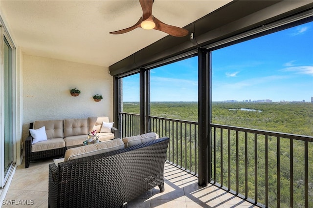 sunroom with ceiling fan and outdoor lounge area