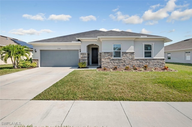 view of front facade with a garage and a front yard